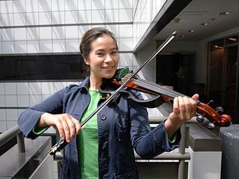 Ph.D. candidate Diana Young puts her Hyperbow into action with a Hyperviolin in June. Young developed the Hyperbow at the MIT Media Lab to measure differences in bowing technique.