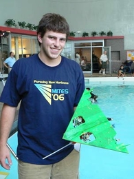 Max Mitchell of Las Vegas holds his team's entry in the underwater robot competition held in the Alumni Pool on July 28, the finale of this year's MITES program. His team, Los Pepos, won the underwater Quidditch match, but not the overall robot competition. <a onclick="MM_openBrWindow('mites1-enlarged.html','','width=509, height=583')">
<span onmouseover="this.className='cursorChange';">Open imag...