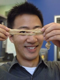 MIT graduate student Trevor Shen Kuan Ng demonstrates the stretchy properties of wheat flour dough.