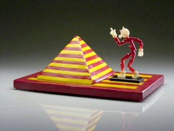 Reddy Kilowatt, right, a glass sculpture by Richard Marquis, combines classical and contemporary glass techniques then adds a good dose of whimsy.