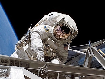 NASA mission specialist Heidemarie Stefanyshyn-Piper pauses for a moment during her Sept. 12 spacewalk, during which she assembled a major truss segment of the International Space Station.
