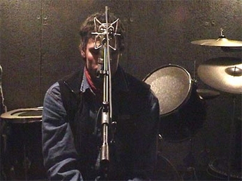 Still from Anri Sala's video "Natural Mystic (Tomahawk #2)," part of the MIT List Visual Arts Center exhibit "Sensorium: Embodied Experience, Technology and Contemporary Art." In the piece, a lone musician vocalizes the ominous yowl of a tomahawk missile as it gets louder and louder, goes silent and suddenly explodes.