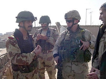 Nathan Minami, far right, conferring with Iraqi Army Officers prior to January 2005 National Elections.