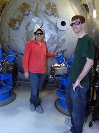 Assistant professor Nergis Mavalvala, left, and Ph.D. student Thomas Corbitt are part of an international team that has devised a way to cool large objects to near absolute zero.