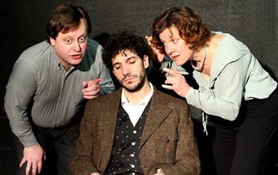 A sleeping Einstein (Robert Najarian) listens to the whispers of  dreamtellers (Debra Wise &amp; Steven Barkhimer) in the production of "Einstein's Dreams," produced by the  Catalyst Collaborative at MIT.