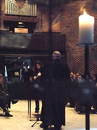 Jean Rife, a lecturer in music and theatre arts at MIT, lit a candle for one of the victims of the shootings at Virginia Tech at an interfaith service at the MIT Chapel on Wednesday.