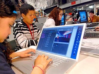 Students from the Umana Barnes Middle School in East Boston (l-r Bonnie Ramos, Roberto Paredes and Kayla Bishop) participating in one of a series of Scratch software workshops held at the MIT Media Lab.