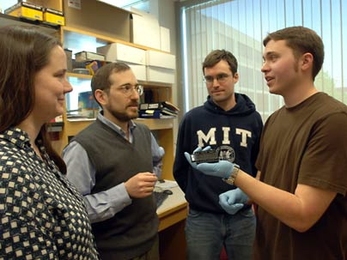 An MIT research team studying gene regulation in mouse and human liver cells has found that master regulatory proteins function differently in the two. From left, post-doc Robin Dowell, Professor Ernest Fraenkel,  graduate student Kenzie MacIsaac and research technician William Gordon discuss their research.