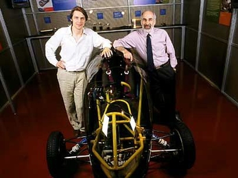 Jeroen Struben, left, and John D. Sterman, of the Sloan School, with an alternative vehicle in the MIT Museum.