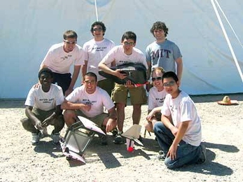 MIT's winning Design/Build/Fly aero-astro team dethroned Oklahoma State in April. Team members were, back row, from left: Brandon Suarez '09, David Sanchez '09, George Kiwada G and Adam Woodworth '07; front row, from left: Nil Armar G, Ryan Castonia '09, Carl Engel '07 and Fuzhou Hu '09.