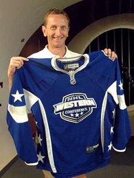 Dr. Kim Blair, an MIT research affiliate in Sports Innovation, holds part of the hockey uniform designed with Reebok for the National Hockey League. Testing in MIT's wind tunnel proved that the prototype reduces the total drag on the player's body by 5 percent.