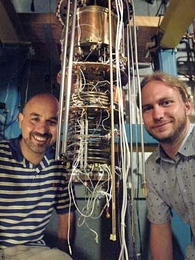 Professor Ray Ashoori, left, and post-doc Oliver Dial have developed a new spectroscopy method that has about 1,000 times finer resolution than other methods. They are shown above in the lab with a dilution refrigerator that they are customizing to continue the work - this refrigerator will allow them to go colder with their experiments, which would allow even better resolution.