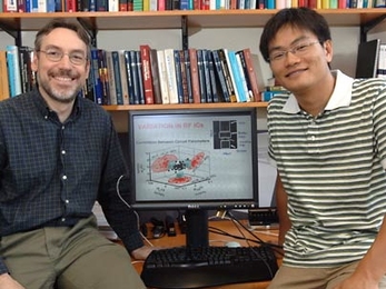 MIT Professor Duane Boning, left, and graduate student Daihyun Lim are working toward increasing the performance of computer chips.