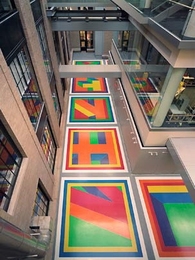 Dazzling colors reflect from Sol LeWitt's 'Bars of Color Within Squares (MIT), 2006' onto both the new Building 6C and Building 8, as seen from Building 4.