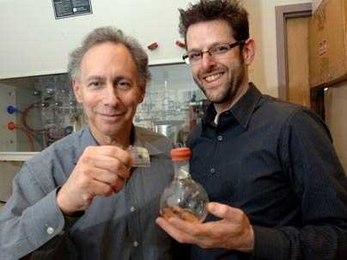 MIT Institute Professor Robert Langer and faculty member Jeffrey Karp, both affiliated with the Harvard-MIT Division of Health Sciences and Technology, display an adhesive they developed that was inspired by the gecko and may have medical and surgical applications.