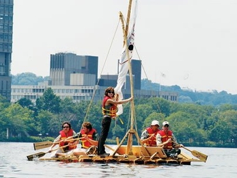 Professor of Archeology and Ancient Technology Dorothy Hosler, back left on the raft, helps row a raft built by four of her students in 2004. Leslie Dewan, standing, recently worked with Hosler to show how similar rafts carried goods through the Americas before the arrival of the Europeans.