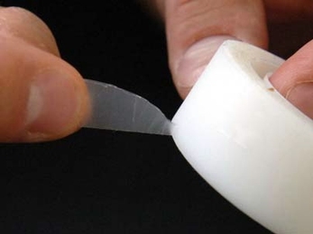 Pedro Reis, an instructor in applied mathematics at MIT, and colleagues have reported the formulation and physics behind the pattern created by adhesive tearing. In this image, Reis demonstrates the way that adhesive tape tears in a triangular shape coming a point.