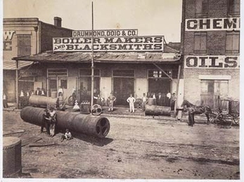 Theodore Lilienthal's photos, examined in a new book by MIT's Gary Van Zante, presented post-war New Orleans businesses as good investment opportunities, bustling yet orderly. Pictured here is the Drummond &amp; Doig Foundry. <a onclick="MM_openBrWindow('nola-boiler-enlarged.html','','width=509, height=583')">
<span onmouseover="this.className='cursorChange';">
<strong>Open image gallery</strong...