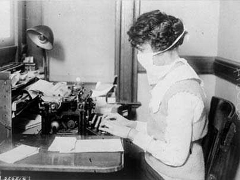 A typist wears a mask in New York during the 'Spanish flu' influenza pandemic of 1918. A new study by MIT graduate student Peter Doshi finds that death rates in pandemic seasons were no higher than--and were sometimes exceeded by--those for severe nonpandemic seasons.