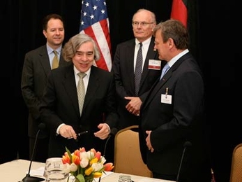 From left, Ian Bowles, Massachusetts Secretary of Energy and Environmental Affairs; Ernest Moniz, director of the MIT Energy Initiative and Cecil and Ida Green Professor of Physics &amp; Engineering Systems; William Hartman, vice president of Fraunhofer USA; and Eicke Weber, director of the Fraunhofer Institute for Solar Energy Systems, sign an agreement to create the MIT-Fraunhofer Center for Sus...