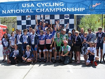 MIT Cycling's national champions celebrate in stars and stripes atop a hard-earned winner's podium.