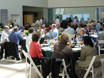 New members talk during the induction ceremony.