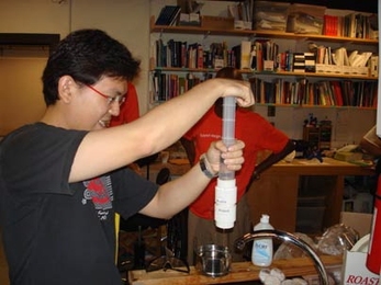 Royce Chew from Singapore works on a low-cost water testing device at last year's International Development Design Summit at MIT.