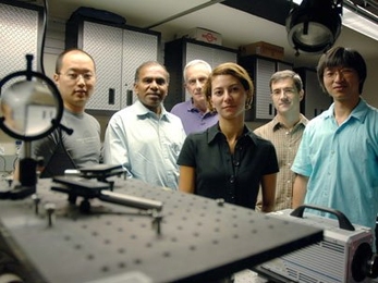 From left, graduate student YongKeun Park, School of Engineering Dean Subra Suresh, Professor Michael Feld, and postdocs Monica Diez-Silva, George Lykotrafitis and Wonshik Choi stand in the MIT Spectroscopy Laboratory. The group has used microscopy techniques to show in unprecedented detail how the malaria parasite attacks red blood cells.
