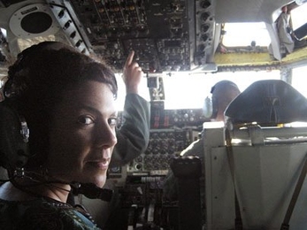 Department of Materials Science Associate Professor Christine Ortiz in the cockpit of an Air Force KC-135 Jet during landing on a Defense Science Study Group trip.