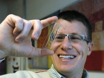 Roman Stocker holds the small microbial ecosystem he developed.