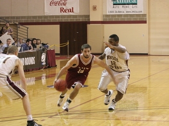 Senior guard Bradley Gampel drives to the basket during the MIT men's basketball team's NCAA Div. III tournament game against Rhode Island College on March 6.