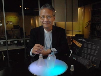 Hiroshi Ishii with one of his early projects, bottles that play music when their stoppers are removed.