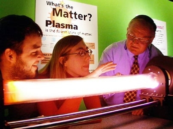Mr. Magnet, a.k.a. Paul Thomas (right), oversees a plasma demonstration with Melissa Hornstein and Ken Marr.