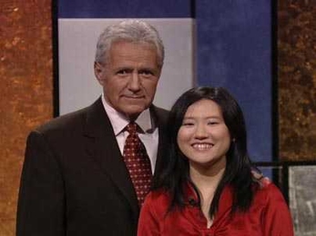 MIT senior Jiaqi 'Jean' Cui poses with Jeopardy! host Alex Trebek.