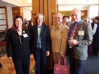 President Susan Hockfield along with 50-year employee Professor Laurence Retman Young, far right, welcomes new members SharonLeah Brown, left, and Elizabeth Zotos to the Quarter Century Club.