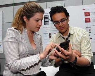 Harvard graduate students Ankush Sharma, right, and Alexis Geancotes, left, (who also study at MIT) represent the MoCa team, which developed mobile diagnostics to improve health care in the developing world.