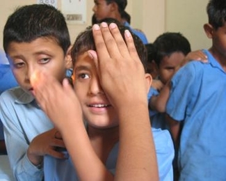 Children are screened for eye problems in New Delhi.