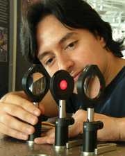 Graduate student José A. Dominguez-Caballero sets up a holopod camera designed to help scientists capture more accurate data from the deep sea. The exhibit permits visitors to capture three-dimensional images of plankton in a mini-aquarium. The camera is being developed with the 3D Optical Systems Group, Professor George Barbastathis and Dr. Cabell Davis from the Woods Hole Oceanographic Institut...