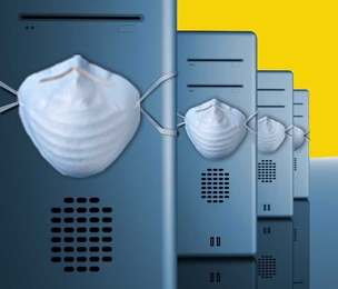 Four computer PCs sit in a line, each with a mask wrapped around center