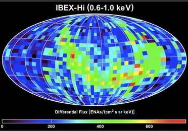 The IBEX satellite maps the boundary layer of the sun's bubble, or heliosheath. This map shows this data plotted on an all-sky image, revealing the bright ribbon-like structure (in greens, yellows and reds) swirling across the sky. 