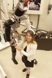 Dava Newman in the Man Vehicle Lab with the robot she uses to test next generation space suits