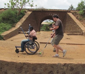 Amos Winter, right, a PhD candidate in mechanical engineering, spent three weeks in January testing the Leveraged Freedom Chair in East Africa.
