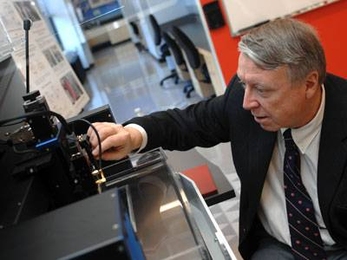 Edwin L. Thomas, head of the Department of Materials Science and Engineering and the Morris Cohen Professor of Materials Science and Engineering, uses a Scanning Acoustic Microscope in MIT's Laboratory for Advanced Materials.