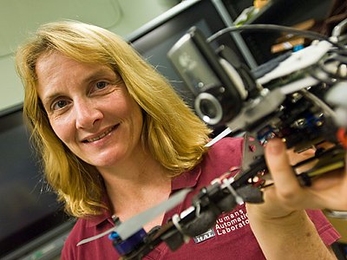 Mary (Missy) Cummings, professor in the Department of Aeronautics and Astronautics and the Engineering Systems Division, holds a quad-rotor.