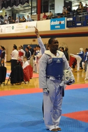 Graduate student Chris Williams is declared the gold-medal winner in the men's blue belt heavyweight sparring division.