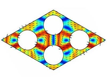 A computer simulation shows phonons, depicted as color variations, traveling through a crystal lattice. The lattice in this case is broken up by round rods whose spacing has been chosen to block the passage of phonons of certain wavelengths.