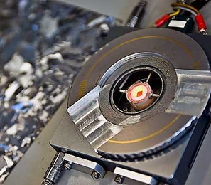 A tiny silicon chip — the glowing orange square at the center of this special heating device — is heated to a temperature well below silicon’s melting point, and then very slowly cooled down. The chip inside this heating device was placed in the path of a synchrotron beam to probe its changes at a molecular level as it went through the retrograde melting process.