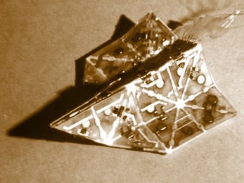 Studded with magnets and electronic muscles known as actuators, a prototype robot developed at MIT can automatically fold itself into an airplane or an origami boat.