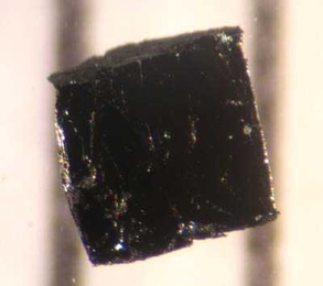 A small sample of Bismuth strontium calcium copper oxide, a cuprate superconductor. Researchers have used a offshoot of string theory to describe some of the strange behavior of this kind of material.
