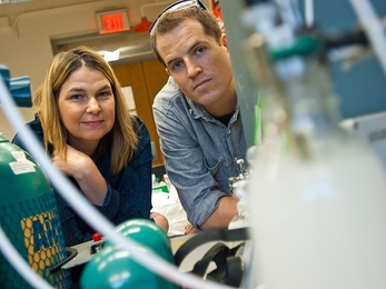 MIT Professor Angela Belcher and graduate student Roberto Barbero are working on a way to convert carbon dioxide gas to carbonates that could be used as building materials.